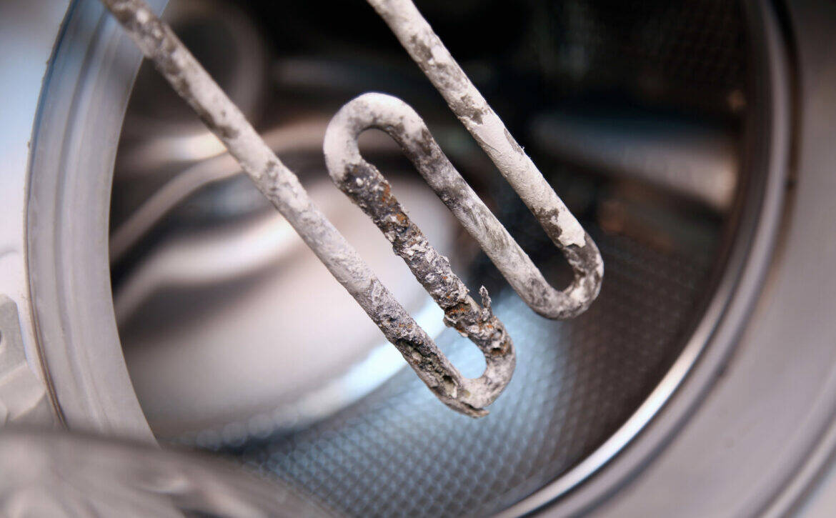 Details,Closeup,Shot,Of,Electric,Heater,From,Washing,Machine