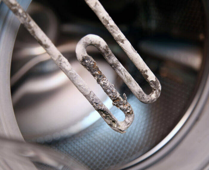 Details,Closeup,Shot,Of,Electric,Heater,From,Washing,Machine